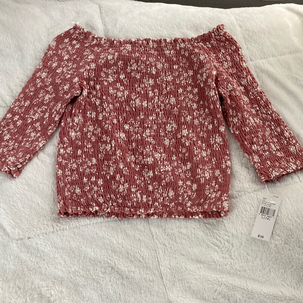 Medium pink tube top with flower pattern.